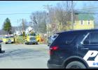 This was the scene Friday afternoon as Wabasha firefighters arrived at the scene of the fire that heavily damaged the West Side Tavern. Smoke can already be seen coming from the roof of the old two-story structure at right as firemen set up hoses to combat the blaze. At right in the photo, a police vehicle blocks traffic on Gambia in this view looking northeast. 