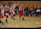 Junior Jordyn Bloom worked to take Eleva-Strum’s Aubrey Lasher baseline.