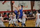 Mondovi’s Cole Kamla (3) and Hunter Evans worked to secure a rebound.