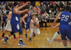 Sophomore Drew Severson drove into the paint looking for a passing option. The Cards excelled at the penetrate-and-pitch against the Wildcats, leading to open looks.