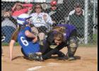 Following an errant throw to third base, senior Anna Accola tried to make it home but was tagged out on the play.
