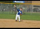 Fielding a grounder, sophomore Dustin Dziekan looked to make the out at first base.