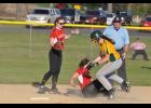 Taking a hit for the team, senior Kenzie Hutchins was knocked down by a Mel-Min runner after tagging her out in the basepath.