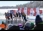 Eleva-Strum “superheroes” jump into the icy lake for the 2014 Polar Plunge. This year, they hope to take the top spot of the Eau Claire region with fundraising.
