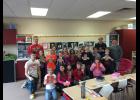 The Eleva-Strum football players can often be found helping out in the elementary schools. Pictured, players worked with third-graders to make Christmas cards for Strum Nursing Home residents last year.
