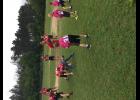 Third-graders donned the pink E-S football jerseys for a flag football game with the varsity players. E-S head coach Chad Hanson says simple activities like this have helped create a family culture that has brought the football program and the community together.