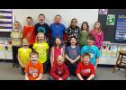 Third graders display a variety of mustached looks to celebrate No Name-Calling Week, when students work with themes to combat bullying.