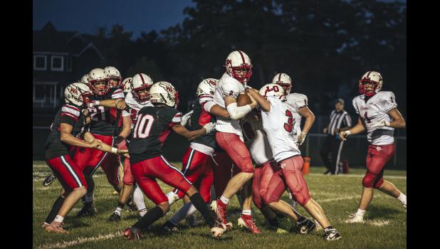 No. 2 Cardinal, Reid Hungerholt, is taken down by no. 1 Falcon, Jonas Dunn. Photos by Sophie Horgan | Editor