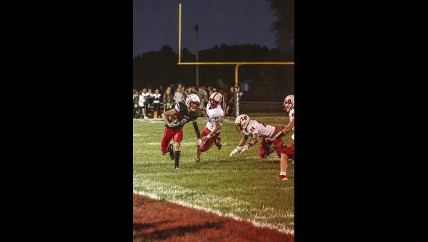 Kevin Williams, Falcon no. 10, makes it ten yards with the ball in hand.