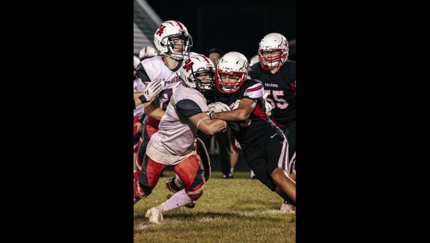 Players from Wabasha-Kellogg and Bethlehem Academy go head to head after the ball.