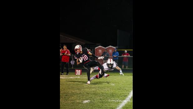 Kevin Williams, no. 8 Falcon, is wiped out by a Cardinal.
