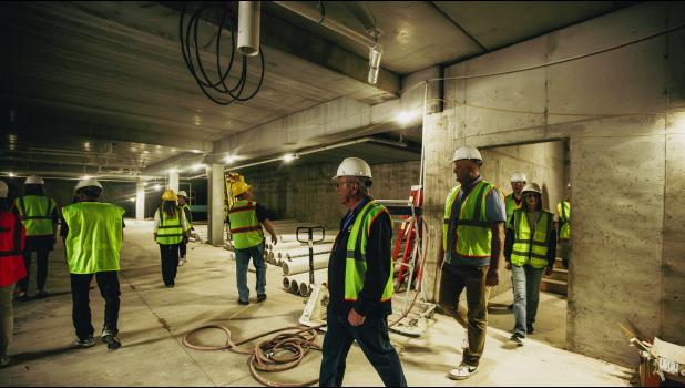 The tour reaches its last destination: the heated underground parking garage, which will offer 38 spaces.