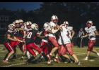 No. 2 Cardinal, Reid Hungerholt, is taken down by no. 1 Falcon, Jonas Dunn.  Photos by Sophie Horgan | Editor