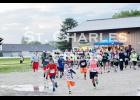 Participants begin Saturday night’s Let it Glow 5K Run/Walk in St. Charles. Photo by Laura Berndt. 
