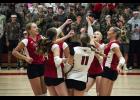 Falcons celebrate an ace serve by junior Kylee Metcalf.   Photos by Sophie Horgan | Editor